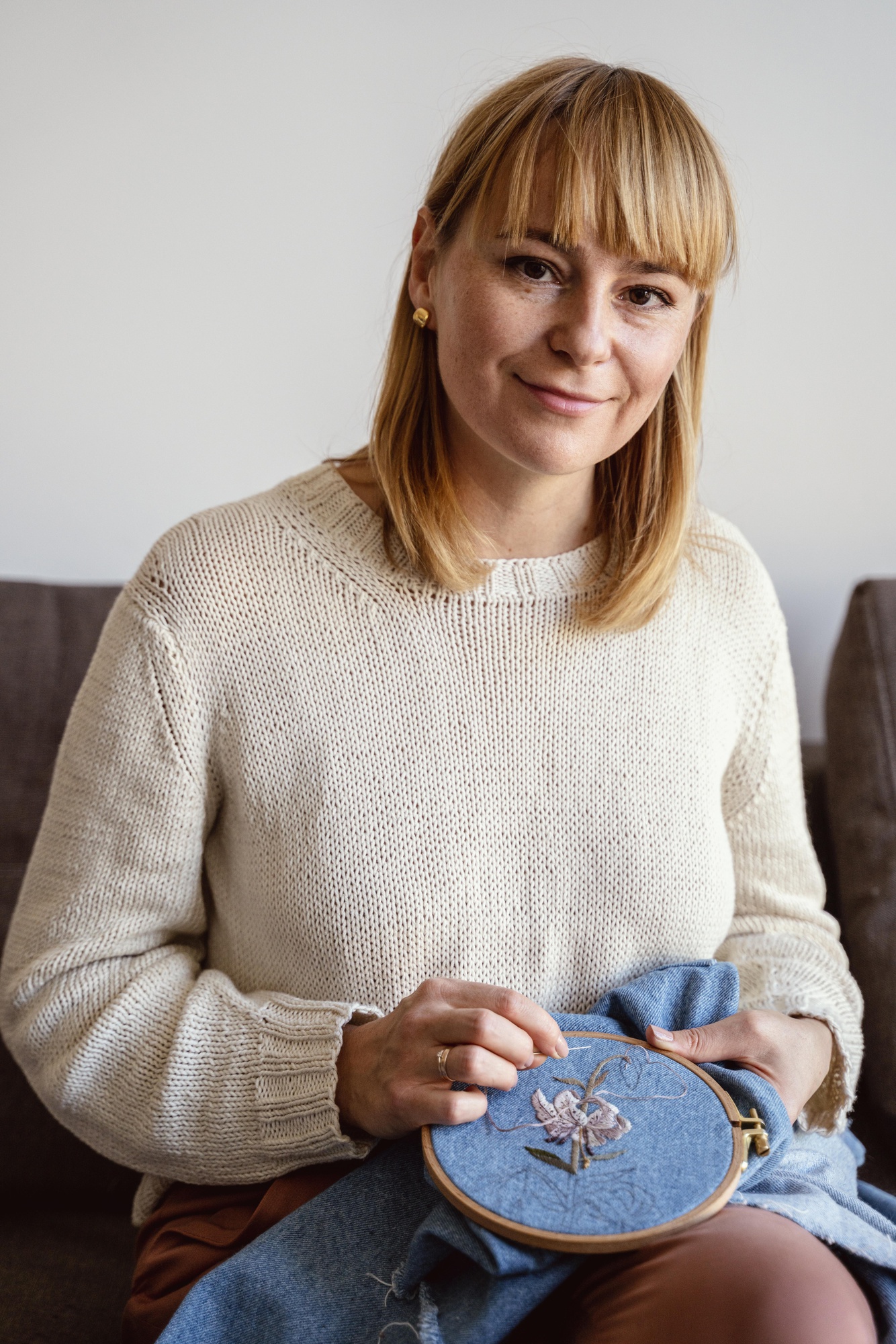 portrait of lead embroiderer Anna